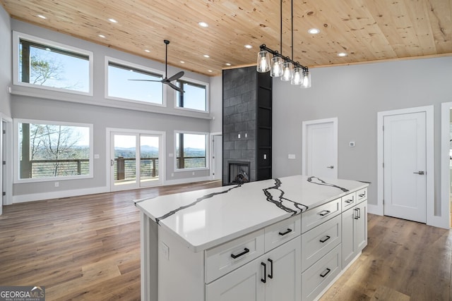 538 Mountain Laurel Rdg, Mineral Bluff, GA 30559 - kitchen featuring wooden ceiling, open floor plan, ceiling fan, a towering ceiling, and light countertops