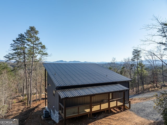 538 Mountain Laurel Rdg, Mineral Bluff, GA 30559 - view of home's exterior with central AC, metal roof, board and batten siding, and a mountain view