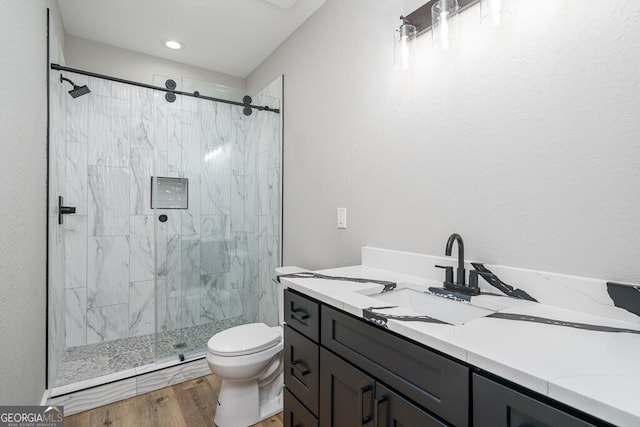 538 Mountain Laurel Rdg, Mineral Bluff, GA 30559 - bathroom with a marble finish shower, toilet, vanity, and wood finished floors