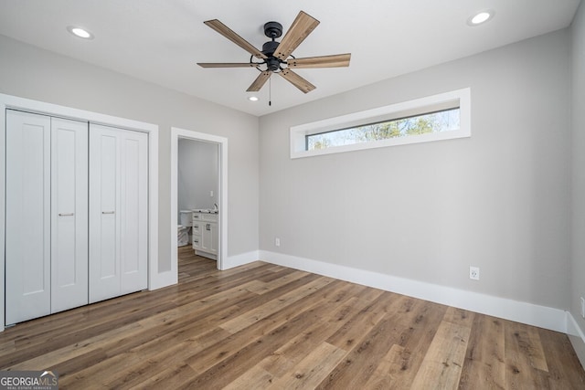 538 Mountain Laurel Rdg, Mineral Bluff, GA 30559 - unfurnished bedroom with baseboards, wood finished floors, a closet, recessed lighting, and ceiling fan