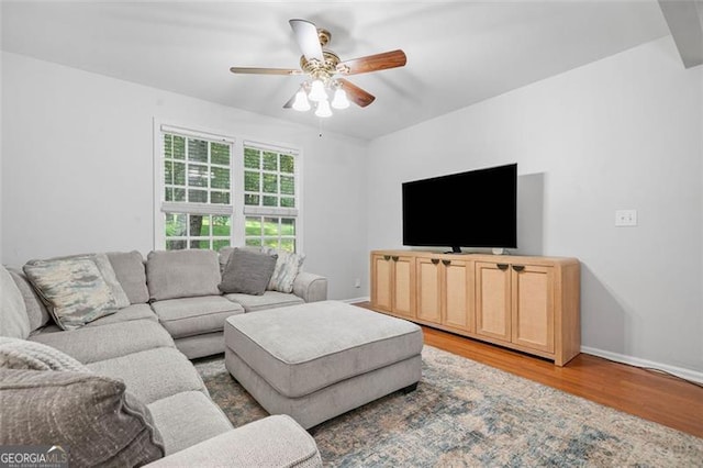 4458 Trickum Rd, Marietta, GA 30066 - living area featuring light wood-style flooring, a ceiling fan, and baseboards