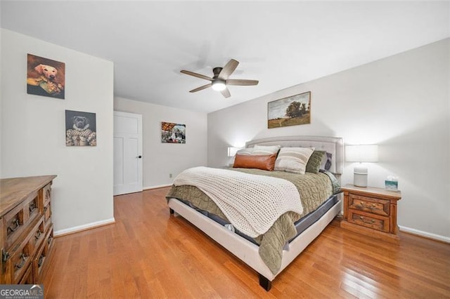 4458 Trickum Rd, Marietta, GA 30066 - bedroom featuring baseboards, light wood-style flooring, and a ceiling fan