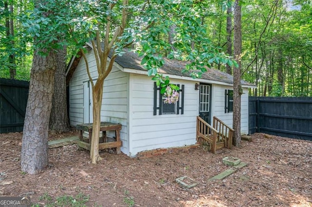 4458 Trickum Rd, Marietta, GA 30066 - view of outdoor structure with a fenced backyard and entry steps
