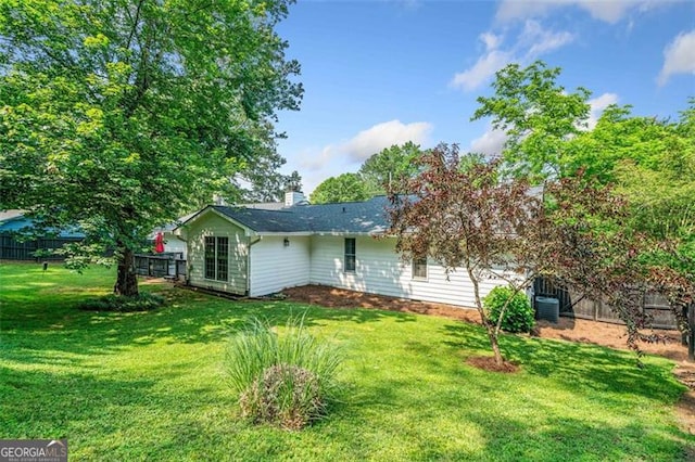 4458 Trickum Rd, Marietta, GA 30066 - back of property featuring a chimney