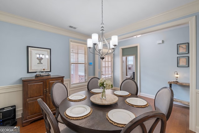 2245 Long Bow Chase, Kennesaw, GA 30144 - dining room featuring a chandelier, wood finished floors, and ornamental molding