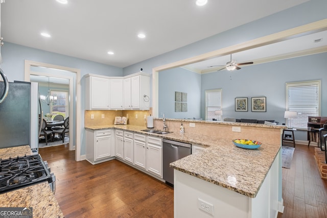 2245 Long Bow Chase, Kennesaw, GA 30144 - kitchen with stainless steel dishwasher, a sink, open floor plan, a peninsula, and dark wood-style floors