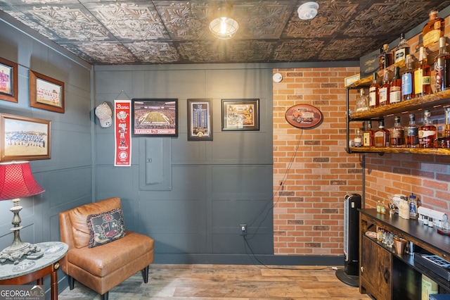2245 Long Bow Chase, Kennesaw, GA 30144 - living area featuring a bar, wood finished floors, and an ornate ceiling