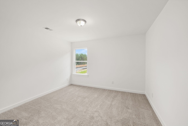 247 Annie Ln, Statham, GA 30666 - spare room with light colored carpet and baseboards