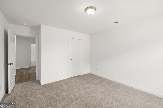 247 Annie Ln, Statham, GA 30666 - unfurnished bedroom featuring carpet flooring and baseboards
