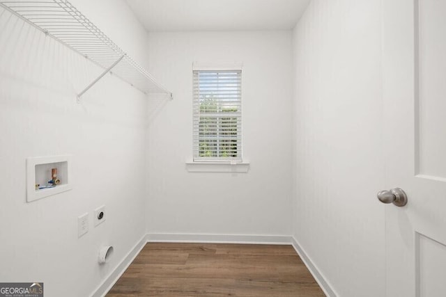 247 Annie Ln, Statham, GA 30666 - laundry room featuring electric dryer hookup, washer hookup, and dark wood-type flooring