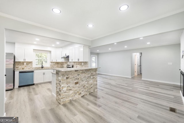 1017 Oak Ridge Dr, Byron, GA 31008 - kitchen with stainless steel appliances, crown molding, recessed lighting, plenty of natural light, and decorative backsplash