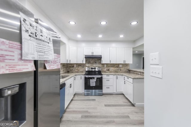 1017 Oak Ridge Dr, Byron, GA 31008 - kitchen with appliances with stainless steel finishes, under cabinet range hood, white cabinets, and recessed lighting