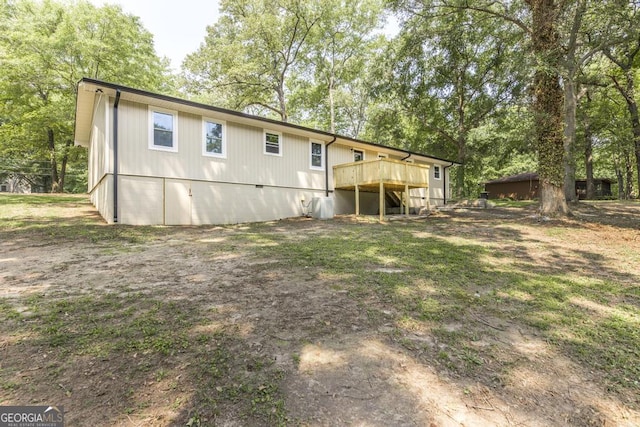 1017 Oak Ridge Dr, Byron, GA 31008 - rear view of property featuring a deck and view of scattered trees