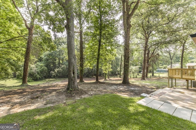 1017 Oak Ridge Dr, Byron, GA 31008 - view of green lawn with a wooden deck