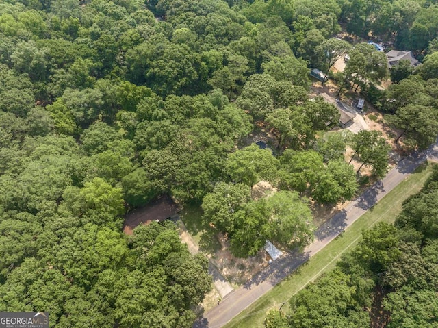 1017 Oak Ridge Dr, Byron, GA 31008 - aerial view of property and surrounding area featuring a heavily wooded area