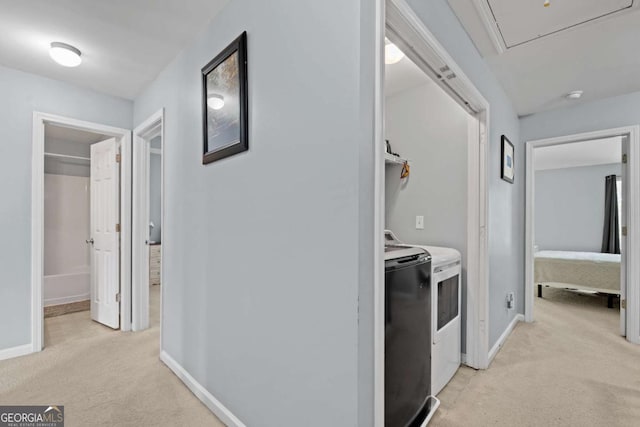 154 Stephens Mill Dr, Dallas, GA 30157 - corridor featuring washing machine and clothes dryer, light colored carpet, and attic access