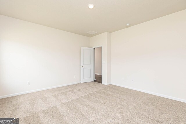 268 Oliver Dr, Locust Grove, GA 30248 - spare room with light colored carpet and baseboards