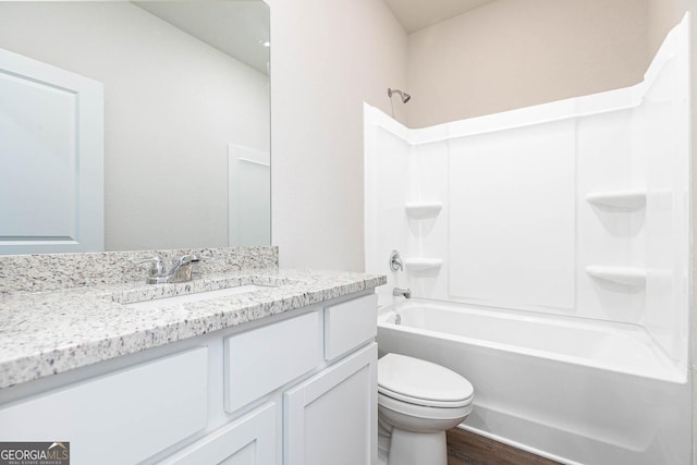 268 Oliver Dr, Locust Grove, GA 30248 - full bathroom with vanity, bathing tub / shower combination, toilet, and wood finished floors