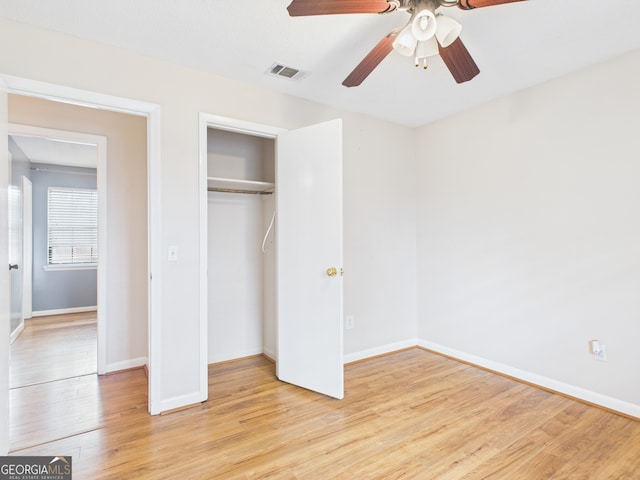 292 Whitetail Cir, Hinesville, GA 31313 - unfurnished bedroom with light wood-style flooring, a closet, and ceiling fan