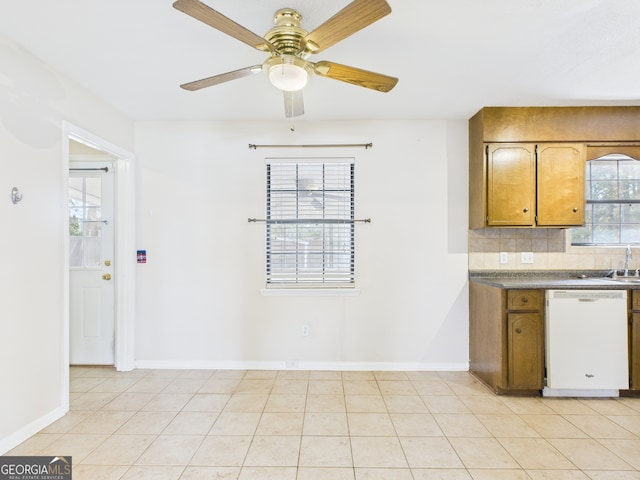 292 Whitetail Cir, Hinesville, GA 31313 - kitchen featuring dishwasher, a ceiling fan, decorative backsplash, brown cabinets, and dark countertops