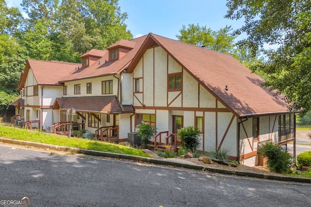 327 Brucken Strasse Unit 609, Helen, GA 30545 - view of front of property featuring stucco siding, central AC unit, and a shingled roof
