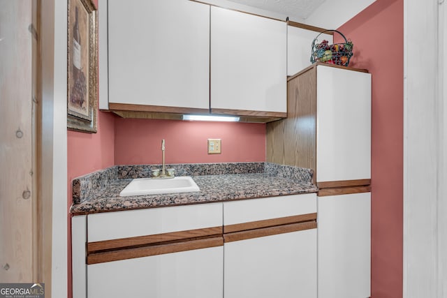 327 Brucken Strasse Unit 609, Helen, GA 30545 - kitchen with a sink and white cabinetry