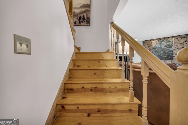 327 Brucken Strasse Unit 609, Helen, GA 30545 - staircase with a textured ceiling