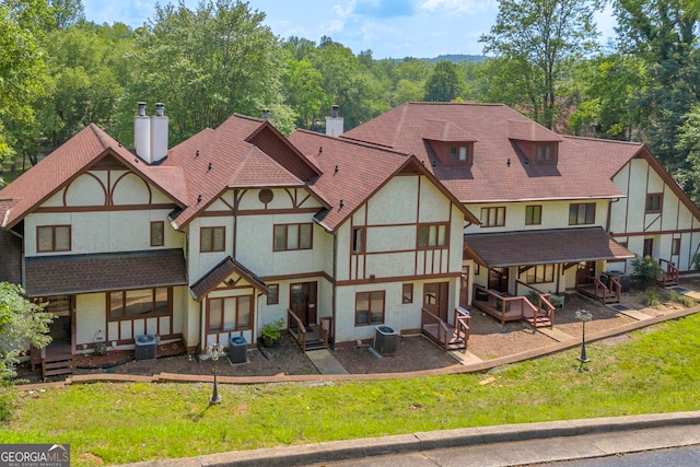 327 Brucken Strasse Unit 609, Helen, GA 30545 - back of property featuring a chimney, stucco siding, and central AC