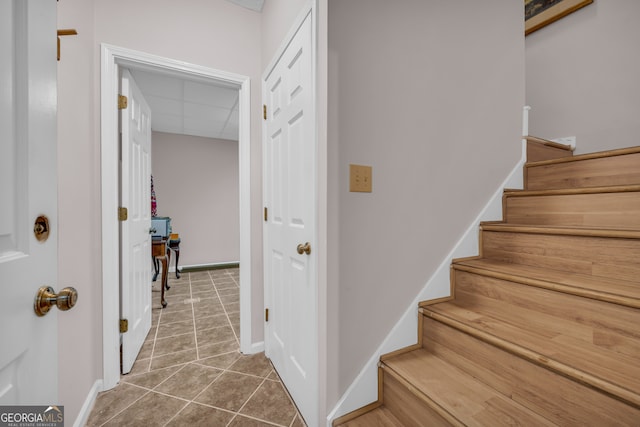 327 Brucken Strasse Unit 609, Helen, GA 30545 - stairway featuring tile patterned floors, a drop ceiling, and baseboards