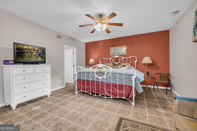 327 Brucken Strasse Unit 609, Helen, GA 30545 - tiled bedroom with a textured ceiling, baseboards, and ceiling fan