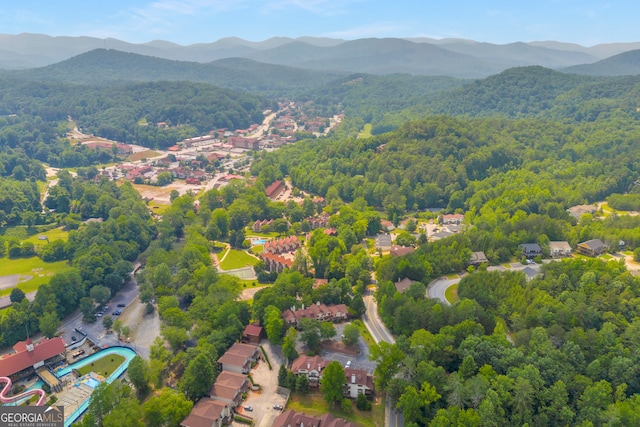 327 Brucken Strasse Unit 609, Helen, GA 30545 - aerial view of property and surrounding area featuring a heavily wooded area and a mountainous background