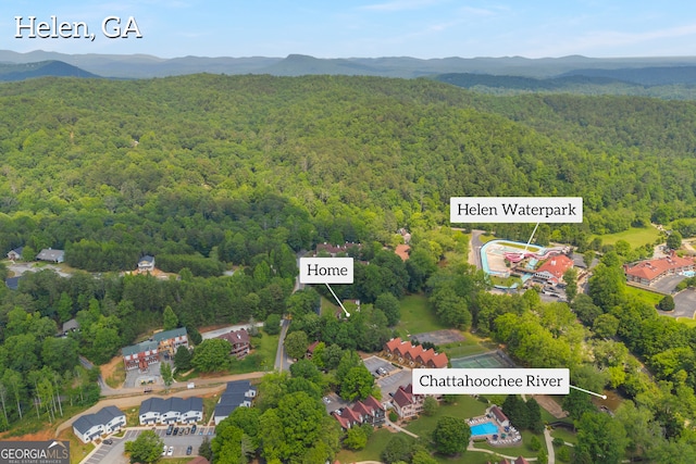 327 Brucken Strasse Unit 609, Helen, GA 30545 - aerial view of property and surrounding area featuring a heavily wooded area and a mountainous background