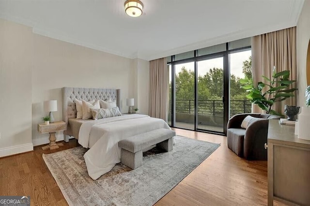 750 Park Ave NE Unit 6E, Atlanta, GA 30326 - bedroom with access to outside, floor to ceiling windows, and wood finished floors