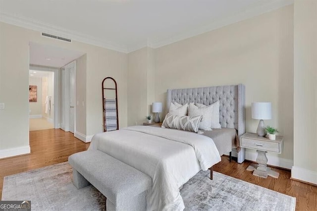 750 Park Ave NE Unit 6E, Atlanta, GA 30326 - bedroom with wood finished floors and crown molding