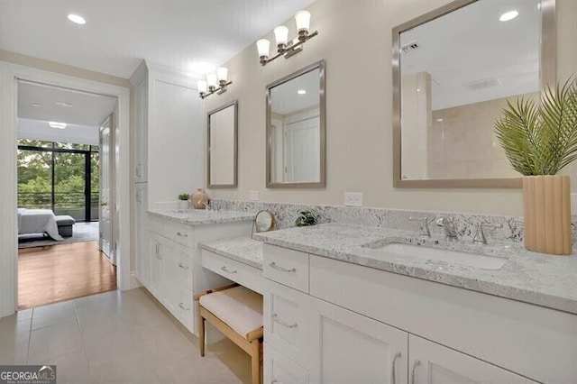750 Park Ave NE Unit 6E, Atlanta, GA 30326 - ensuite bathroom featuring vanity, recessed lighting, and tile patterned flooring