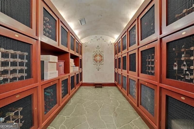 750 Park Ave NE Unit 6E, Atlanta, GA 30326 - wine room featuring lofted ceiling and stone flooring