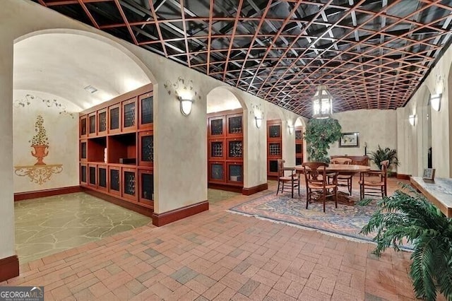 750 Park Ave NE Unit 6E, Atlanta, GA 30326 - wine area featuring arched walkways and brick patterned flooring