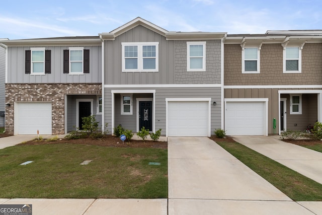 124 Saginaw Ct, Locust Grove, GA 30248 - multi unit property with board and batten siding, a garage, a front yard, and concrete driveway