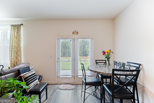 124 Saginaw Ct, Locust Grove, GA 30248 - dining room with wood finished floors and baseboards