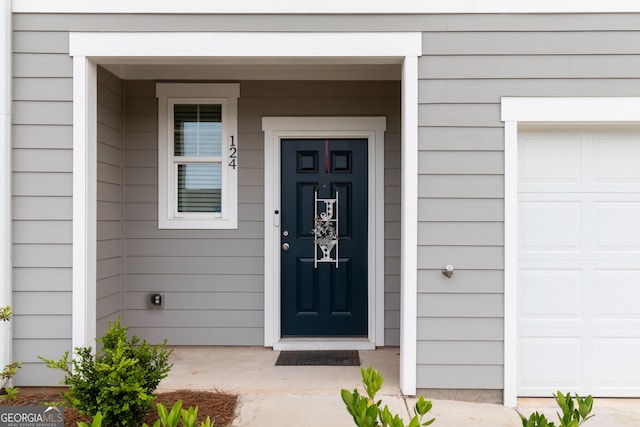 124 Saginaw Ct, Locust Grove, GA 30248 - doorway to property with an attached garage