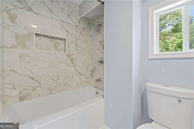 2158 Huckleberry Ln, Lithia Springs, GA 30122 - bathroom featuring healthy amount of natural light, bathtub / shower combination, and toilet