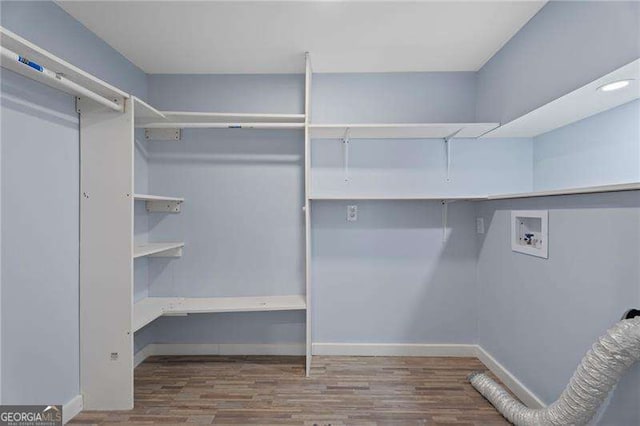 2158 Huckleberry Ln, Lithia Springs, GA 30122 - walk in closet featuring wood finished floors