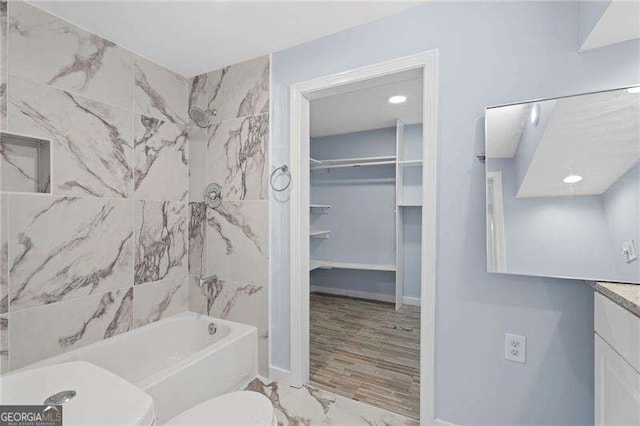 2158 Huckleberry Ln, Lithia Springs, GA 30122 - full bath with toilet, shower / tub combination, vanity, marble finish floors, and baseboards