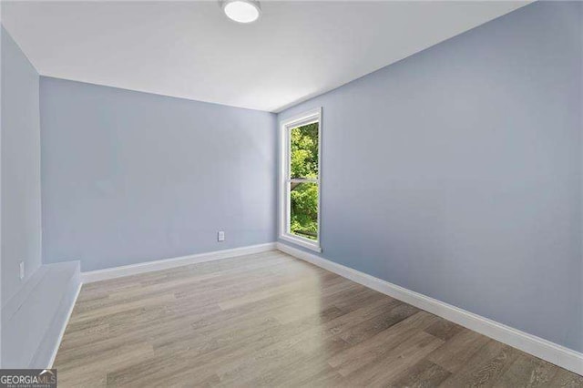2158 Huckleberry Ln, Lithia Springs, GA 30122 - empty room featuring wood finished floors and baseboards