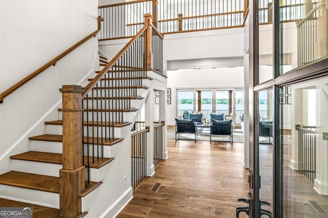 117 W View Way, Eatonton, GA 31024 - stairs featuring a towering ceiling and wood finished floors