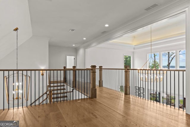 117 W View Way, Eatonton, GA 31024 - hallway featuring a chandelier, wood finished floors, crown molding, recessed lighting, and an upstairs landing