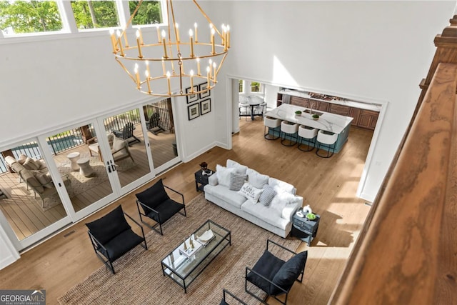 117 W View Way, Eatonton, GA 31024 - living room with a high ceiling, a chandelier, and wood finished floors
