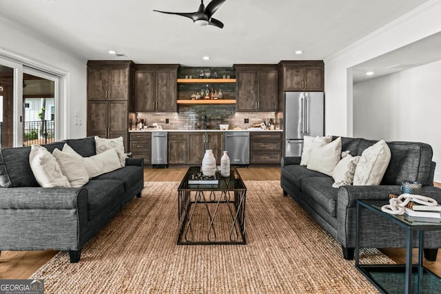 117 W View Way, Eatonton, GA 31024 - living area with bar with sink, ceiling fan, ornamental molding, light wood-style flooring, and recessed lighting