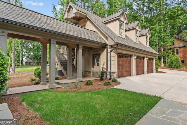117 W View Way, Eatonton, GA 31024 - view of front of home featuring concrete driveway, stone siding, stucco siding, stairs, and a shingled roof