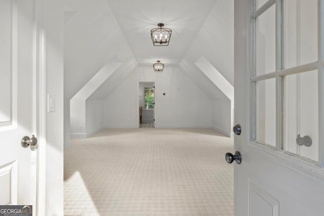 117 W View Way, Eatonton, GA 31024 - additional living space with lofted ceiling, carpet floors, and a chandelier